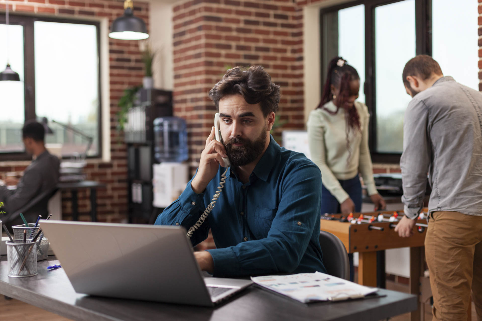 businessman taking phone with manager discussing company turnover while working marketing strategy startup office diverse businesspeople brainstorming ideas planning business collaboration