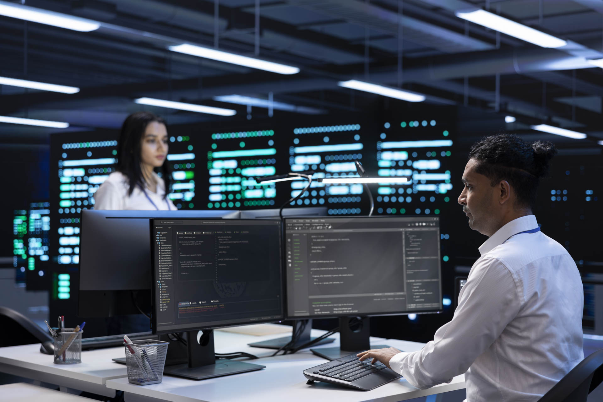 Cybersecurity 2 coworkers data center using computers find firewall misconfigurations